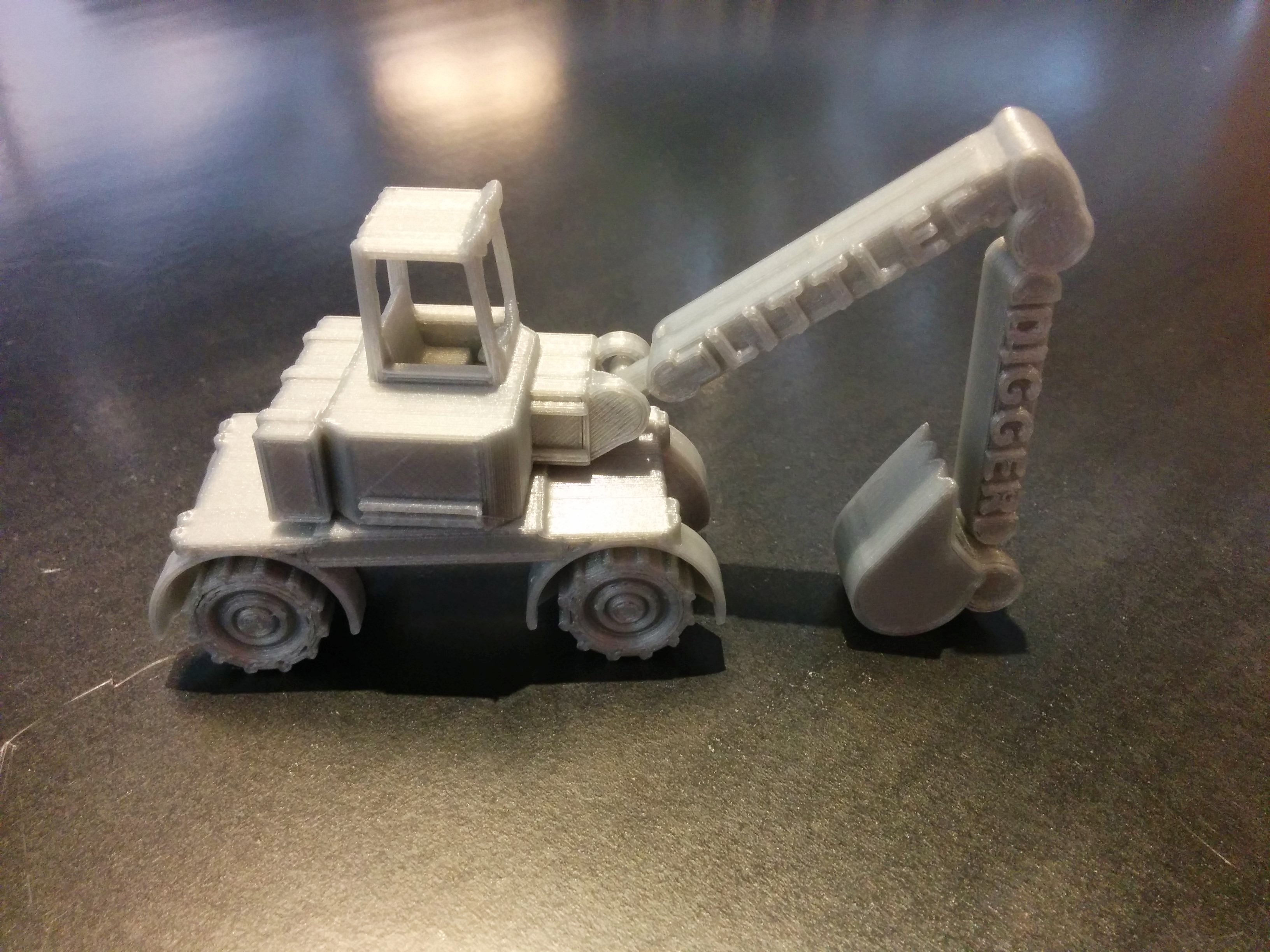 3d printed excavator labeled "Little Digger"